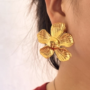 Chic oversized gold flower earrings with irregular metal texture for a bold fashion statement