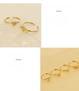 Detailed macro view of 18K gold plated adjustable stainless steel rings with various designs