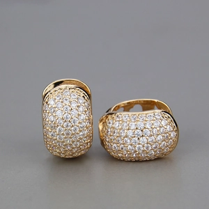 Close-up of gold hoop earrings with micro-pave set round cubic zirconia crystals