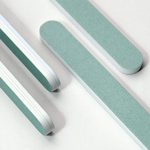 Double-sided green and white nail buffer block for manicure polishing and shaping