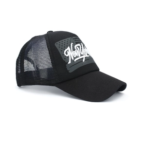 Detail of black mesh trucker hat featuring breathable back panels and New York embroidery