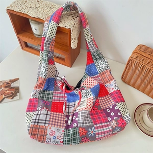 Detailed view of colorful patchwork corduroy tote bag in a cozy Zakka style setting