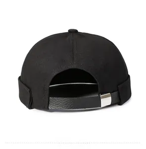 Detail view of the black cotton docker hat featuring an adjustable leather strap and metal buckle