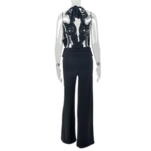 Back view of a black halter neck backless top paired with wide-leg trousers on a mannequin