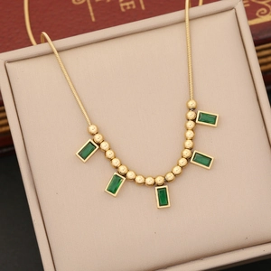 Golden stainless steel necklace with five emerald green rectangular zircon pendants