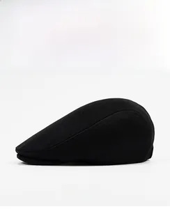 Side view of a premium black cotton newsboy cap with refined stitching details