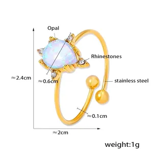 Detailed view of titanium steel ring with light blue opal and sparkling rhinestones
