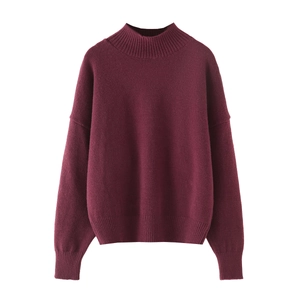 Women's burgundy knit sweater with a round neck and relaxed loose fit in plain solid color