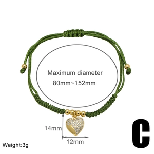 Detailed view of woven green bracelet with heart pendant showing size and dimensions