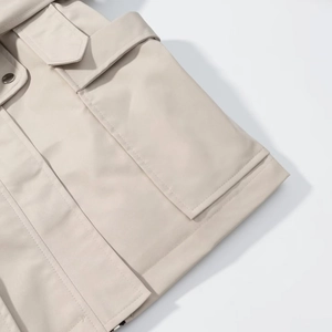 Chic beige waisted trench coat with tie-belt and premium stitching details for women