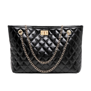 Classic black quilted tote bag with golden chain straps and rectangular twist lock detail