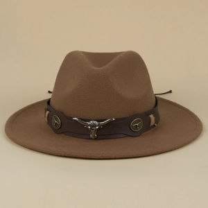Detail of brown wool fedora hat featuring a vintage leather band and silver bull head charm