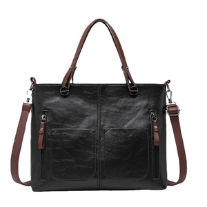 Large black PU leather tote bag with brown handles and two front zipper pockets
