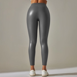 Rear view of high waisted dark gray faux leather leggings showing fit and smooth texture
