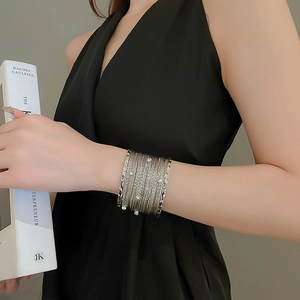 Close-up of silver multilayer rhinestone bracelet on wrist with elegant minimalist styling