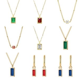 Golden necklace and earring set featuring emerald and ruby square zircon gemstones