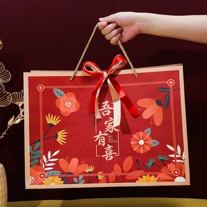 Traditional red Chinese wedding gift bag with gold handle and floral 'Wu Jia You Xi' design