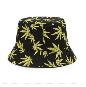 Detail of leaf pattern print on a black canvas bucket hat with high quality stitching