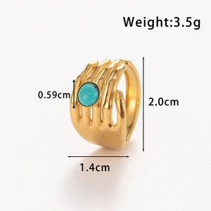Adjustable gold crown ring with turquoise stone inlay and skull hand design detail