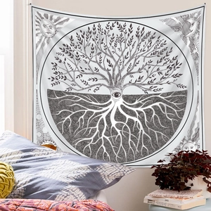 Detail of Tree of Life tapestry featuring sun and moon patterns in a cozy bedroom setting