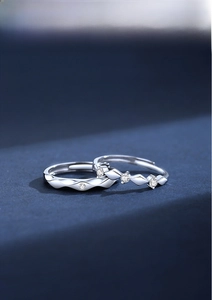 Macro view of adjustable S925 sterling silver couple rings with zircon inlays