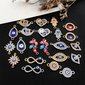 Assorted evil eye charms in gold and silver alloy with enamel and rhinestones