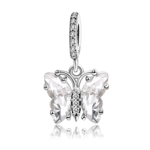 Detailed macro view of butterfly charm with clear crystals on silver plating