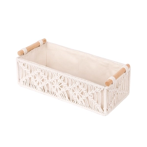 Handwoven rectangular cotton rope storage basket with wood handles and linen lining
