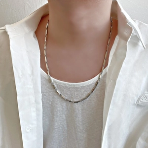 Detail of silver titanium steel geometric link chain worn on neck for men