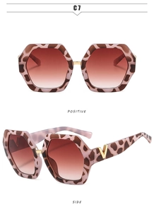 Detail of leopard print frames with gradient red lenses and gold V logo on side