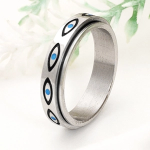 Silver stainless steel spinner ring with blue Eye of Horus patterns in vintage style