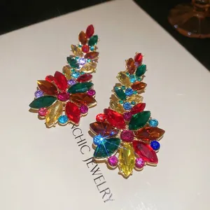 Luxury oversized flower earrings with colorful crystals on a gold metallic base