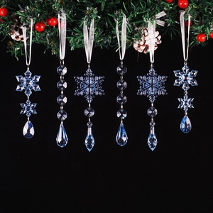 Set of 6 blue acrylic crystal snowflake and teardrop ornaments on a black background
