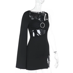 Detail of black one-shoulder mini dress with waist cutout and rhinestone metal ring