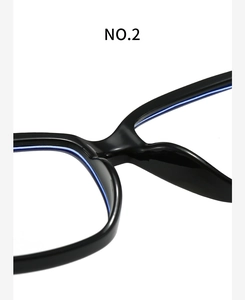 Close-up of gloss black square glasses frame showing smooth nose pads and bridge detail