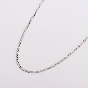 Macro detail of silver-toned flat curb chain link with high-shine metallic finish