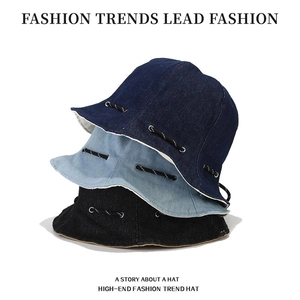 Three-pack denim bucket hats in navy, light blue, and black with adjustable drawstrings