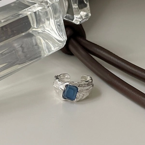 Irregular textured S925 silver ring with a blue rectangle gemstone in minimalist style