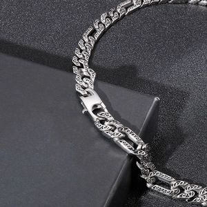 Silver stainless steel NK chain bracelet with engraved totem patterns on a black gift box