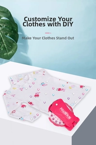 Close-up of pink handheld DIY hair and clothing gem stamper applying rhinestones to fabric