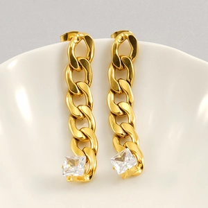 Elegant gold-plated chain link earrings with square cubic zirconia drop on white ceramic