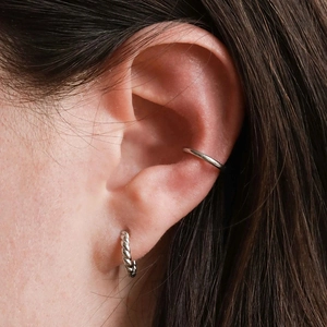 Minimalist S925 silver twist hoop earrings and ear cuff set worn on female ear