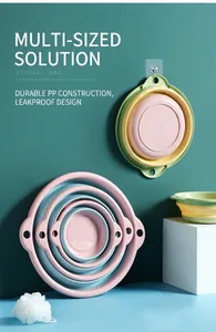 Trois tailles de bassines pliables en rose et vert avec trou de suspension
