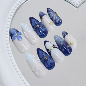Ocean theme press-on nails with blue floral patterns, 3D shell textures and pearls
