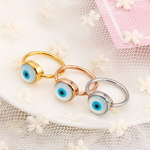 Three-piece Evil Eye ring set in gold, rose gold, and silver plating on lace fabric