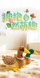 Detail of plush mandarin duck dolls with realistic feather texture on a soft rug
