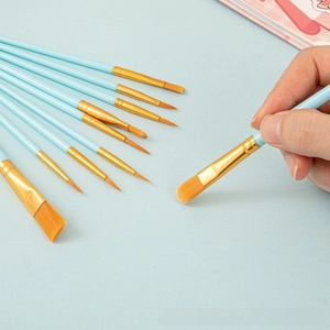 Detail view of 10-piece nylon paint brushes with blue handles and gold ferrules for artists