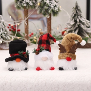 Three plush Christmas gnomes with LED lights, featuring reindeer and plaid hat designs