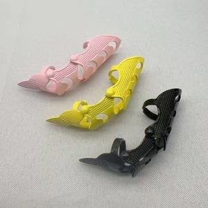 Detail of punk full finger armor ring with hollow multi-joint design in pink yellow and black