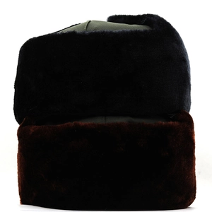 Detail of thickened winter trapper hats with warm faux fur ear flaps in black and brown